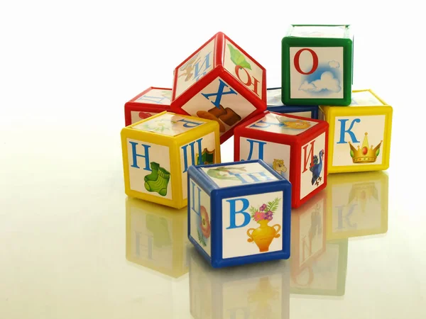 Children`s cubes, a wonderful educational toy for the child. Playing cubes the kid comprehends the basics of grammar and develops his thinking.