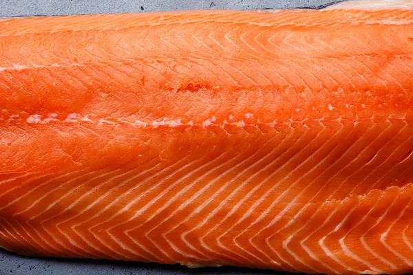 Fresh salmon fillet close-up background