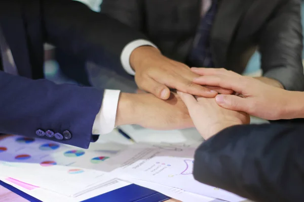 Business man joining hands together, teamwork concept