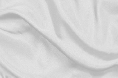Pürüzsüz beyaz ipek kumaş ya da saten lüks kumaş dokusu düğün arka planı olarak kullanılabilir. Lüks ve soyut arzu için kumaşlar.