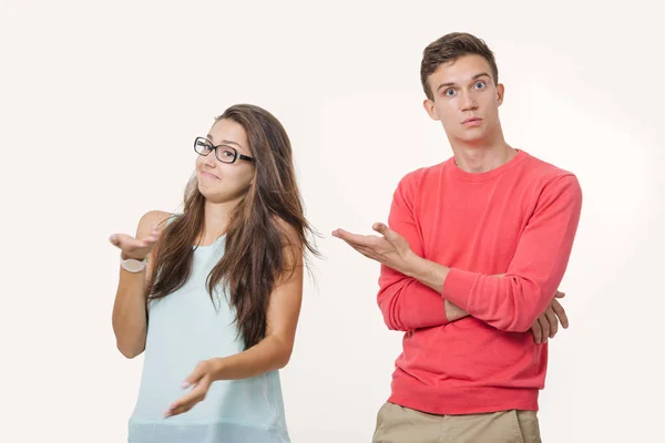 Studio shot of disgruntled couple wearing casual clothes standing back to back frowning their faces. Discord in the relationship. Divergence of points of view — Stock Photo, Image