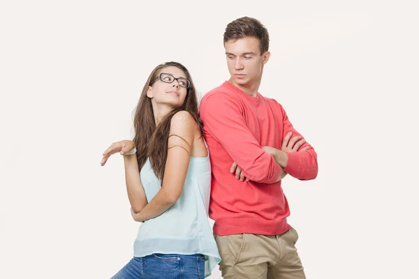 Studio shot of disgruntled couple wearing casual clothes standing back to back frowning their faces. Discord in the relationship. Divergence of points of view — Stock Photo, Image