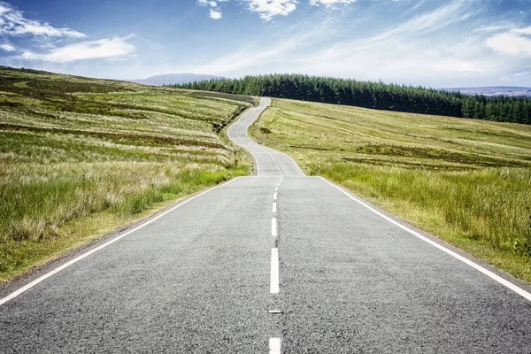 Road ahead highway disappearing into the distance