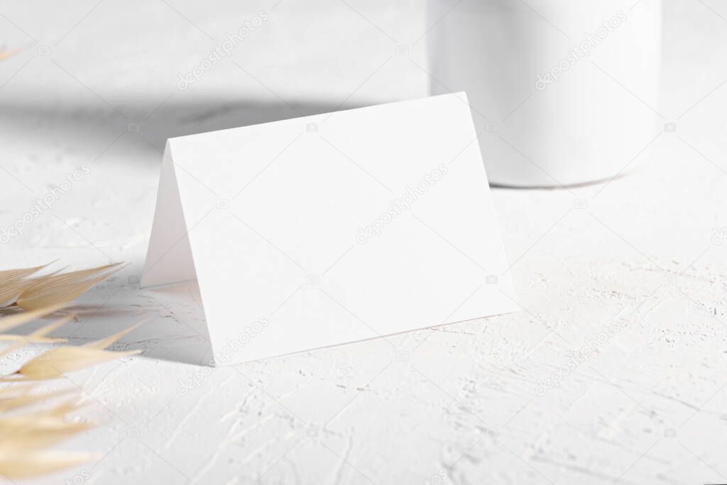 Luxury Mockup template, empty stationery card with dry plants flower and perfume on a white background and design element for wedding invitation, rsvp, thank you card, greeting, business card