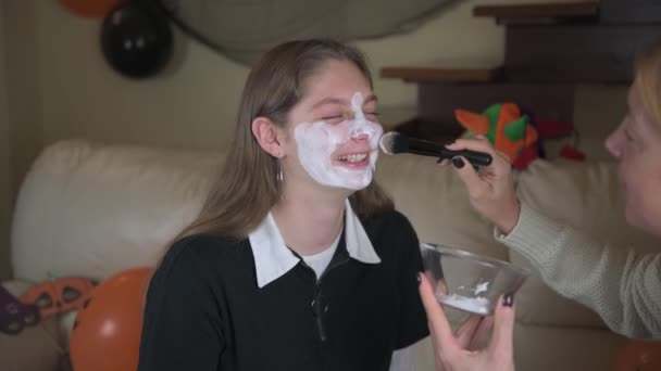 Mom Paints Her Daughter White Makeup Halloween Girl Laughs Home — Stock Video