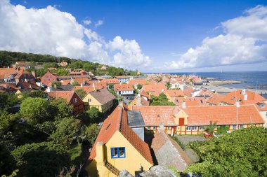 Aerial view of small town - with beautiful, small houses - at the seaside, Gudhjem, Bornholm, Denmark clipart