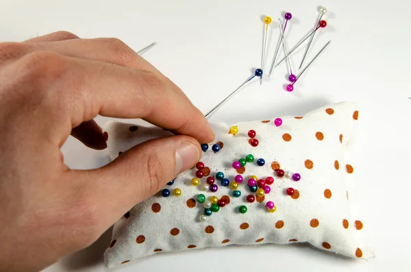 Needle invisible with colored ends in their hands