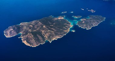 Aerial view of seashores of Greece shot from airplane clipart