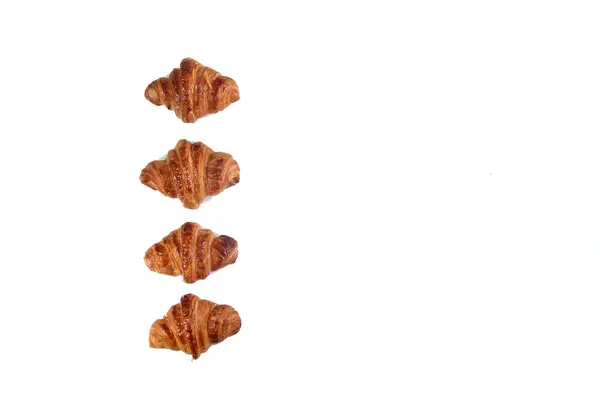 Fyra Croissanter Isolerade Vit Bakgrund Platt Låg Bilden Innehåller Kopieringsutrymme — Stockfoto