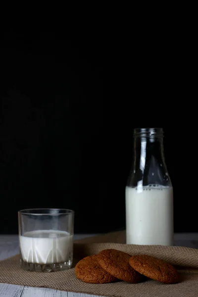 Cookies Bottle Glass Milk Canvas Napkin White Wooden Background Black — Stock Photo, Image