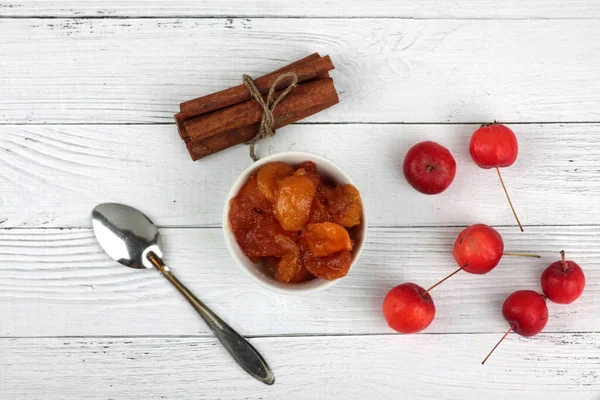 Bowl Apple Jam Red Apples Spoon Cinnamon Sticks White Wooden — Stock Photo, Image