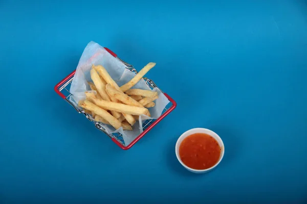 Shopping Basket French Fries Parchment Paper Bowl Sauce Blue Background — Stock Photo, Image