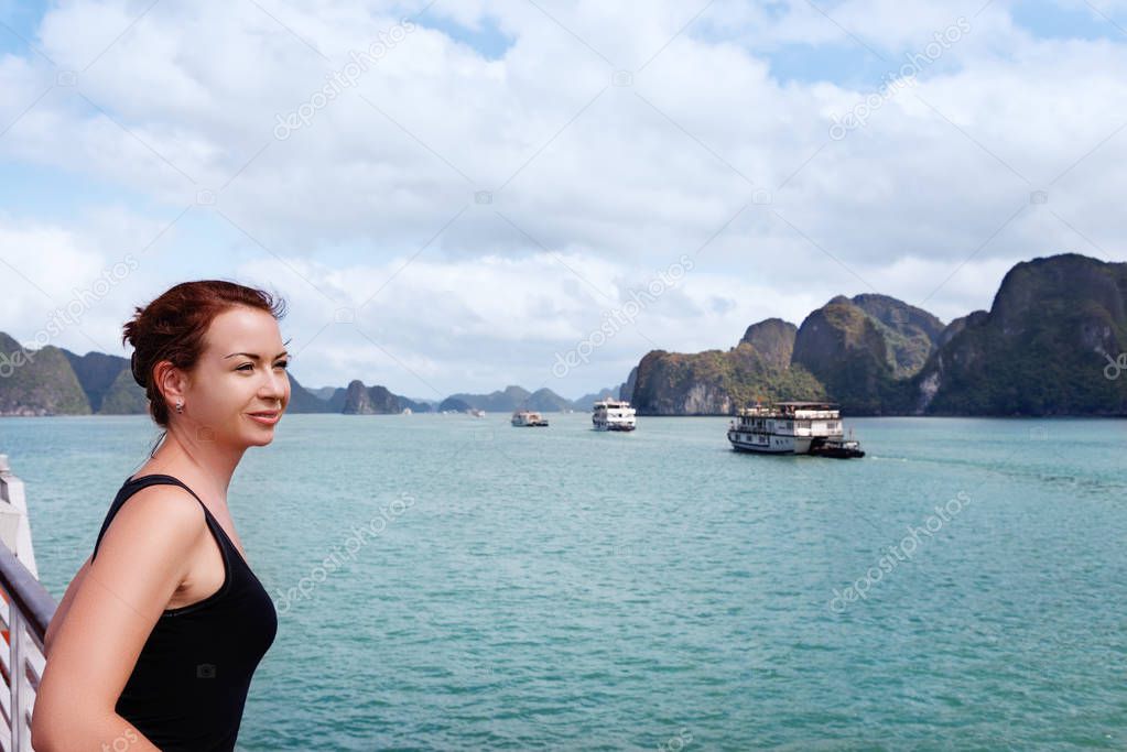 Young woman traveling by boat among the islands.