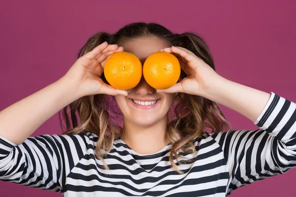 Portrait Cheerful Young Girl Holding Two Oranges Her Face Pink — Stock Photo, Image