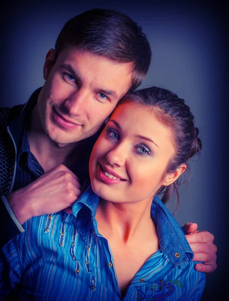 cute young couple man and woman portrait in studio