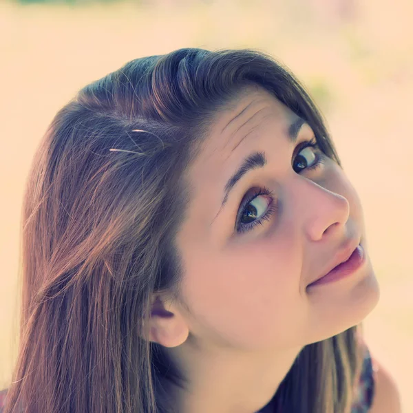 girl looking with interest on a light background