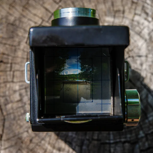 old film camera on a wooden surface