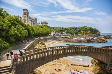 Church Sainte-Eugenie and beautiful coast line In Biarritz, France clipart