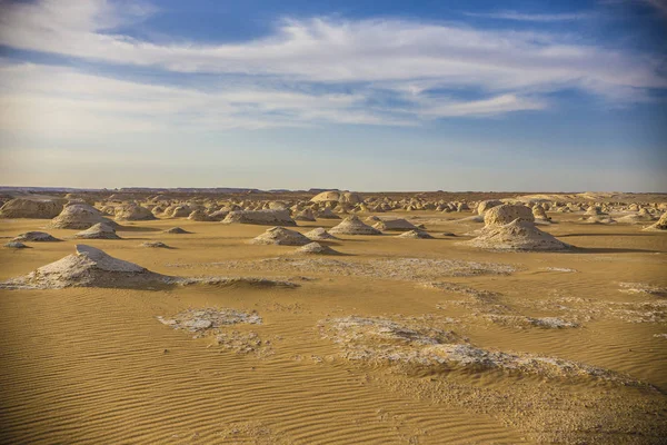 Desert landscape in Egypt. White desert in Egypt (Farafra). White stones and yellow sands.