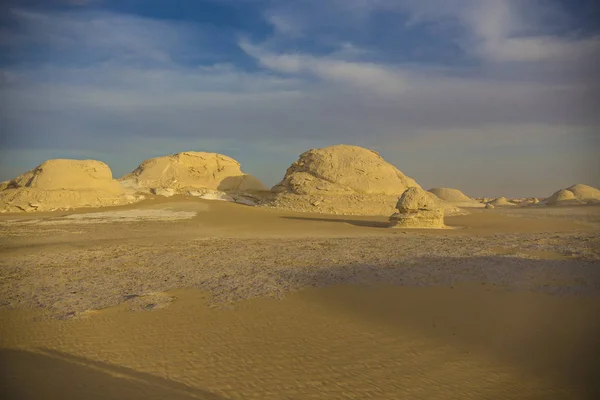 Desert landscape in Egypt. White desert in Egypt (Farafra). White stones and yellow sands.