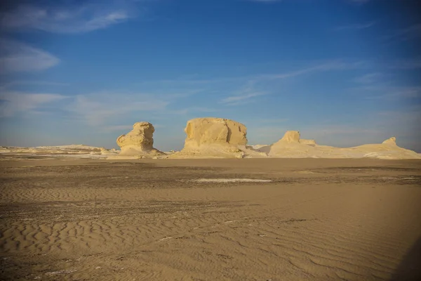 Desert landscape in Egypt. White desert in Egypt (Farafra). White stones and yellow sands.