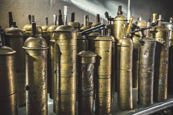 Vintage old metal coffee mills close up on the flea market. Vintage kitchen utensils, coffee mills.