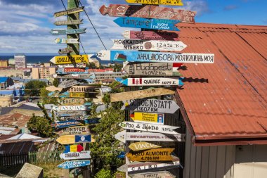 PUNTA ARENAS, CHILE - February 2019: Mileage Distance Signs near the Mirador in Punta Arenas, Chile clipart