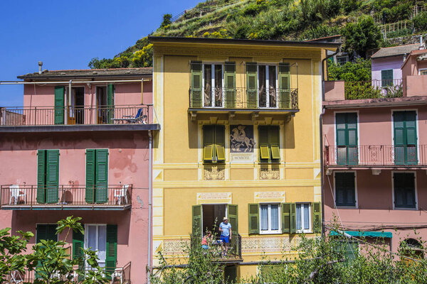 Old traditional Italian house with wooden windows and balconies in Riomaggiore, Cinque Terre, Liguria, Italy