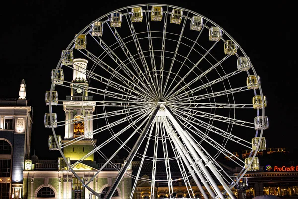 Fragment of Ferris Wheel by night. Ferris wheel eliminated at the night city