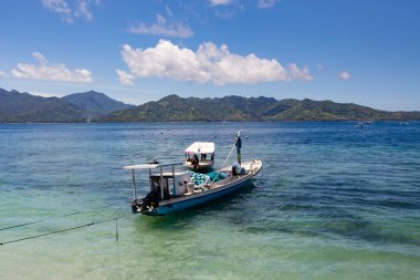 White sand beach and boats in the water  on the  beautiful Gili Meno island, Bali, Indonesia