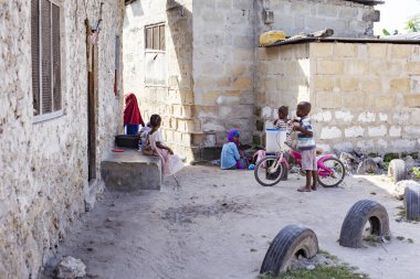 Nungwi village, poor house and people on the street, Zanzibar, Tanzania