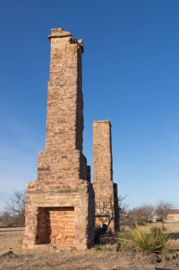Chimneys at abandoned fort phantom hill in Texas clipart