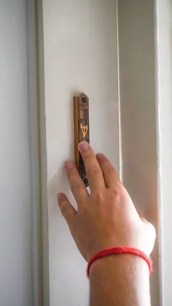 Man Kisses Mezuzah Entrance Touches His Finger — Stock Fotó