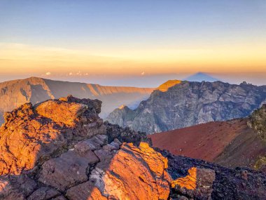 cirque de cilaos at sunset view from piton des neiges clipart