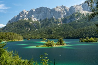 view on the beautiful zugspitze mountain and the eibsee in bavaria, germany clipart