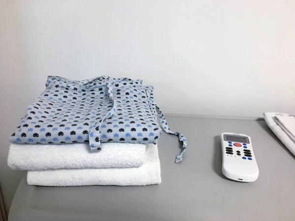 hospital robe and towels folded