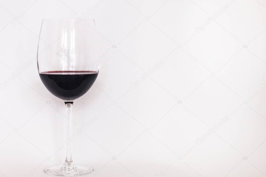 Glass of red wine with white background