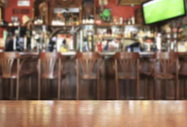 Wooden table on the background of the bar