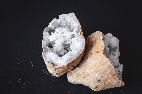 Agate. A cross section of agate stone with geode on a black background. Origin: Morocco, Sidi Rachal