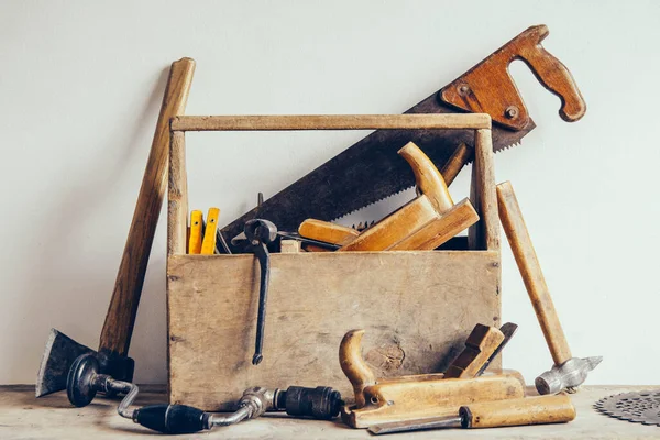 Old Wooden Tool Box Full of Tools. Old carpentry tools. Still life