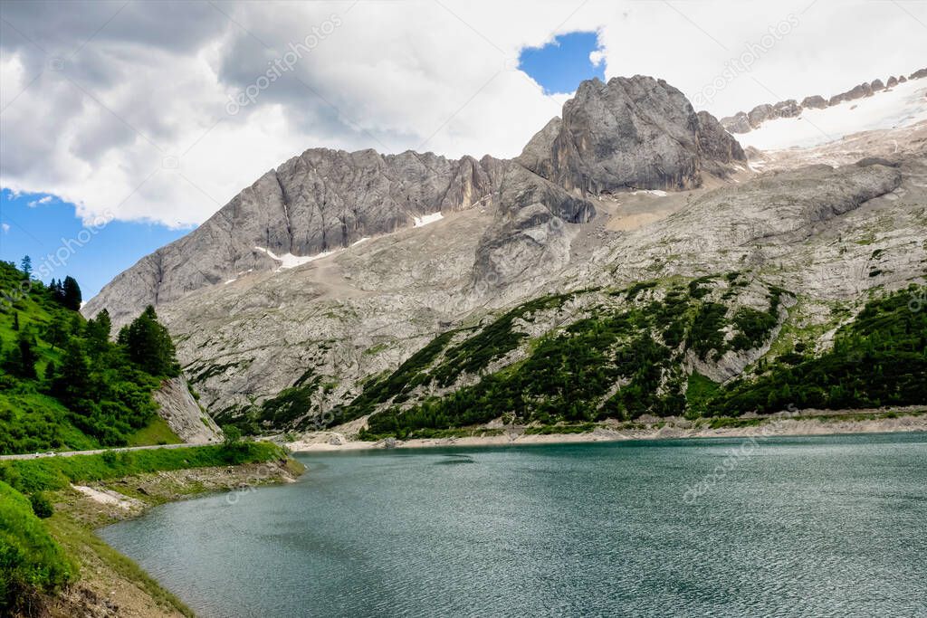 Alpine landscape in the Dolomites, Italy. Glacier Marmolada and Lago di Fedaia.