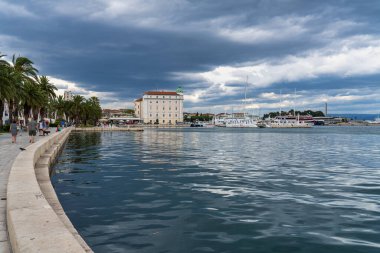 Splitska Riva Promenade with palm trees between the harbor and Diocletian s palace in Split, Croatia clipart