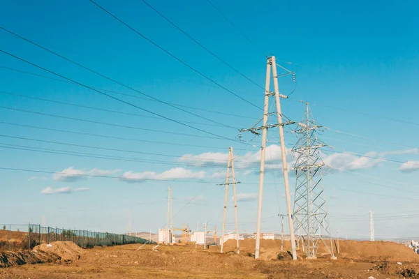 electric power transmission pylon on inner mongolia grassland against blue sky  ,China