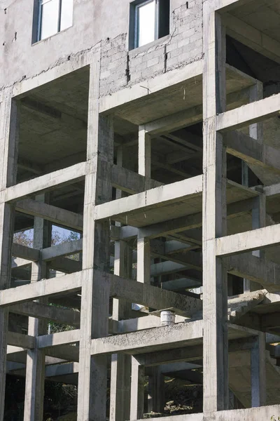 Unfinished white building in a construction site, Abstract architecture fragment with stair