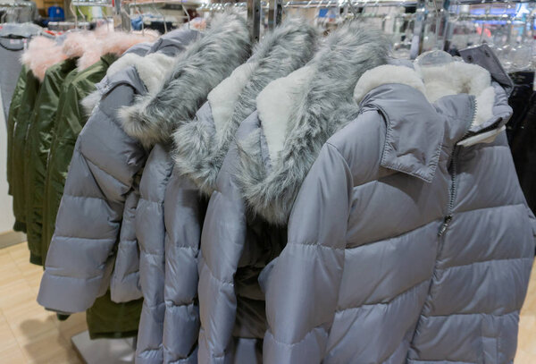 Winter fashion down jackets on a clothes rack
