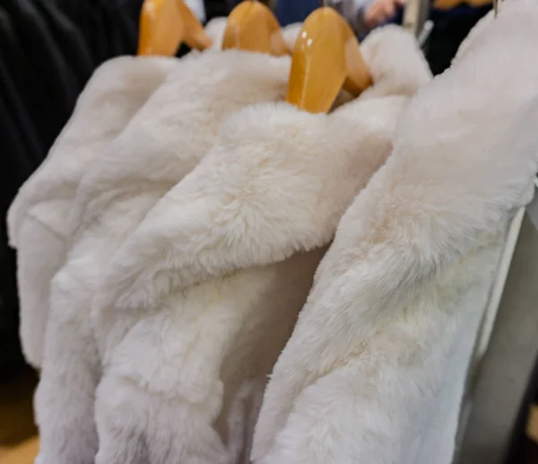 Faux fur jacket for winter season on a clothes rack