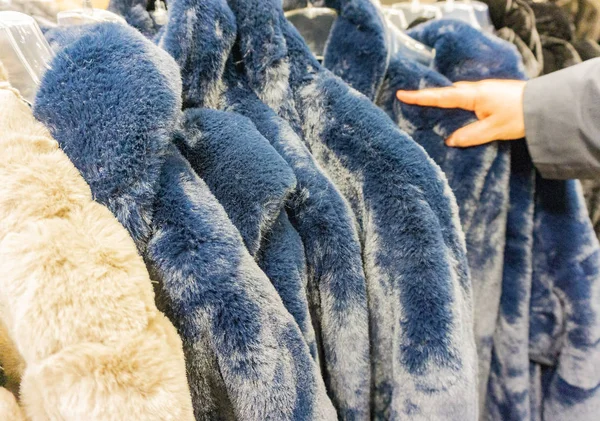 Faux fur jacket for winter season on a clothes rack