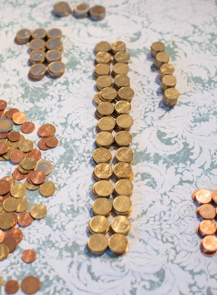 Small change Euro coins are counted by a woman