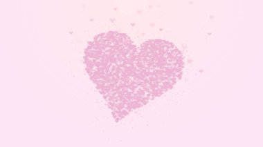 Bulanık kırmızı kalp açık pembe arka planda izole edilir. Küçük kalplerin birikimi bir büyük kalp oluşturur.