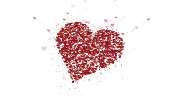 Red heart is isolated on white background. Accumulation of little hearts creates one large heart. The whole heart is being zoomed. Close up. Copy space. — Stock Video